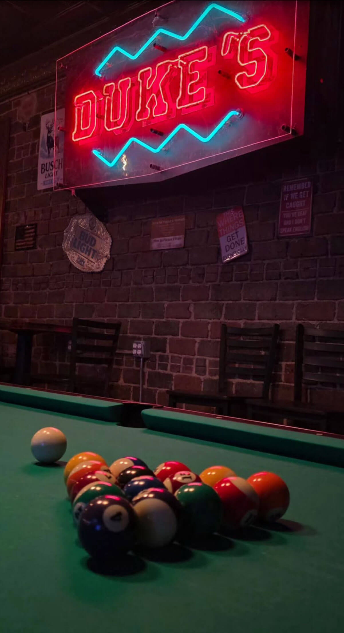 Duke's neon sign and pool table