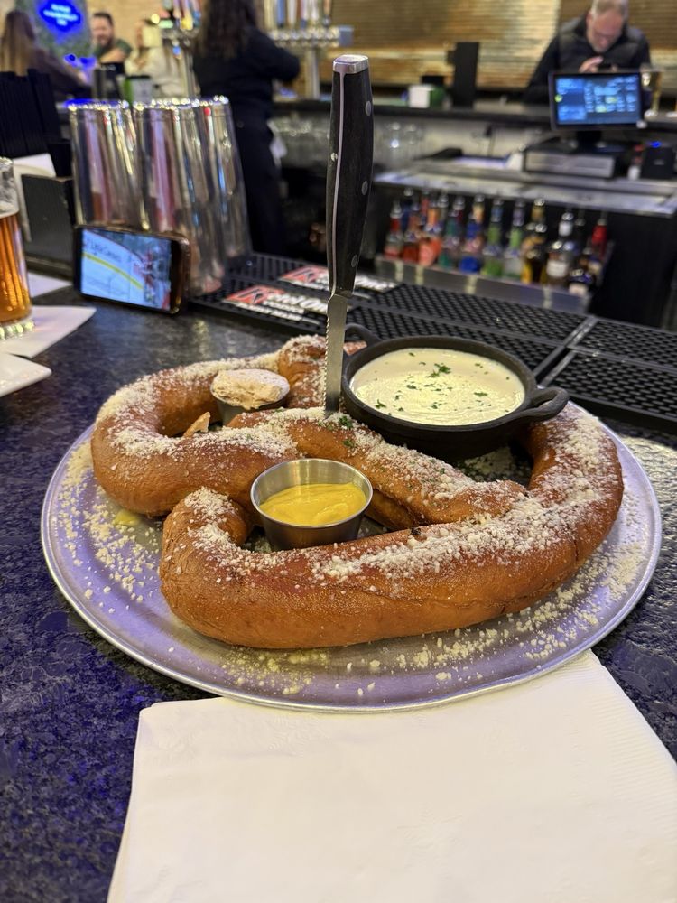 Giant pretzel with cheese sauce