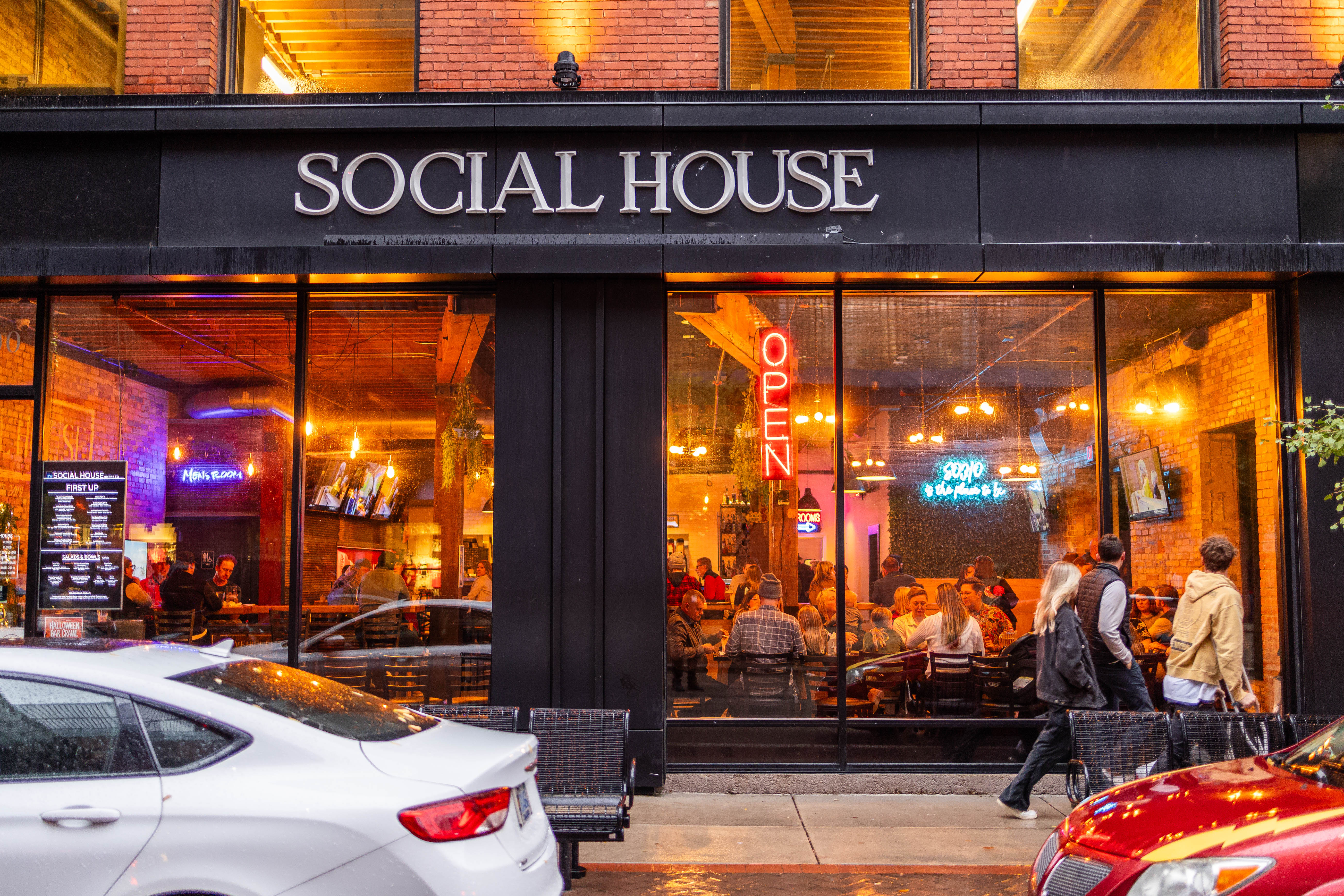 Social House Grand Rapids exterior at night, warm lighting, SOCIAL HOUSE signage
